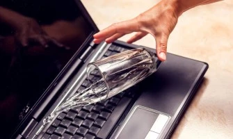 water over laptop